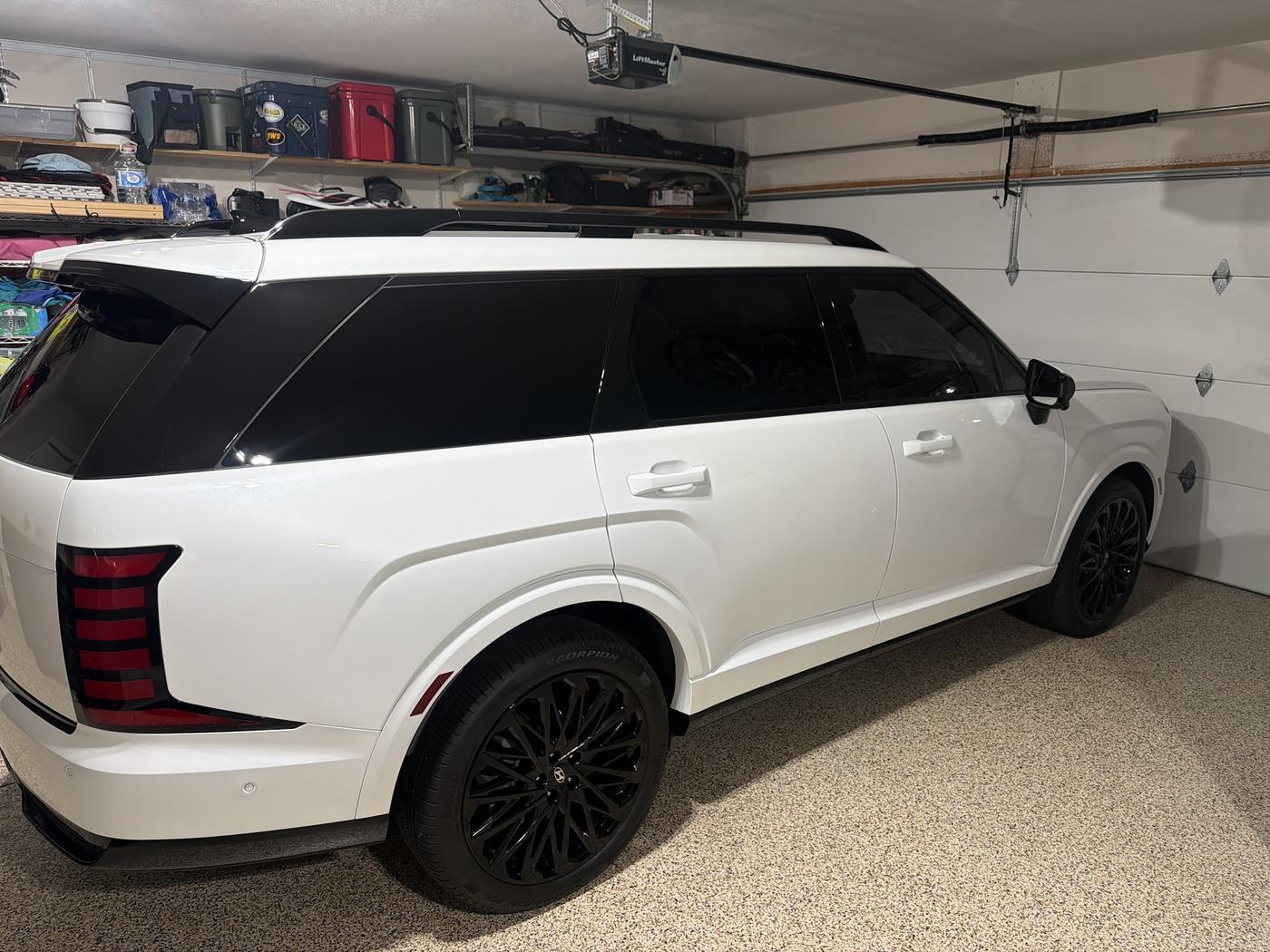 A white SUV finished, in a customer's garage